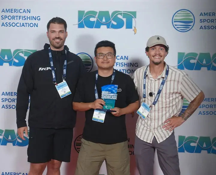 Three members of the ArcPro team holding the ICAST New Product Showcase award